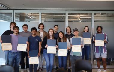 2021 and 2022 FYSA cohort graduates pose for a group picture with their certificates.